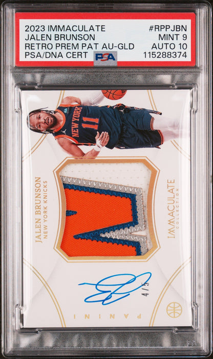 front card 2023 PANINI IMMACULATE COLLECTION RETRO PREMIUM PATCH AUTOGRAPHS JALEN BRUNSON RETRO PREM PAT AU-GLD PSA MINT 9 